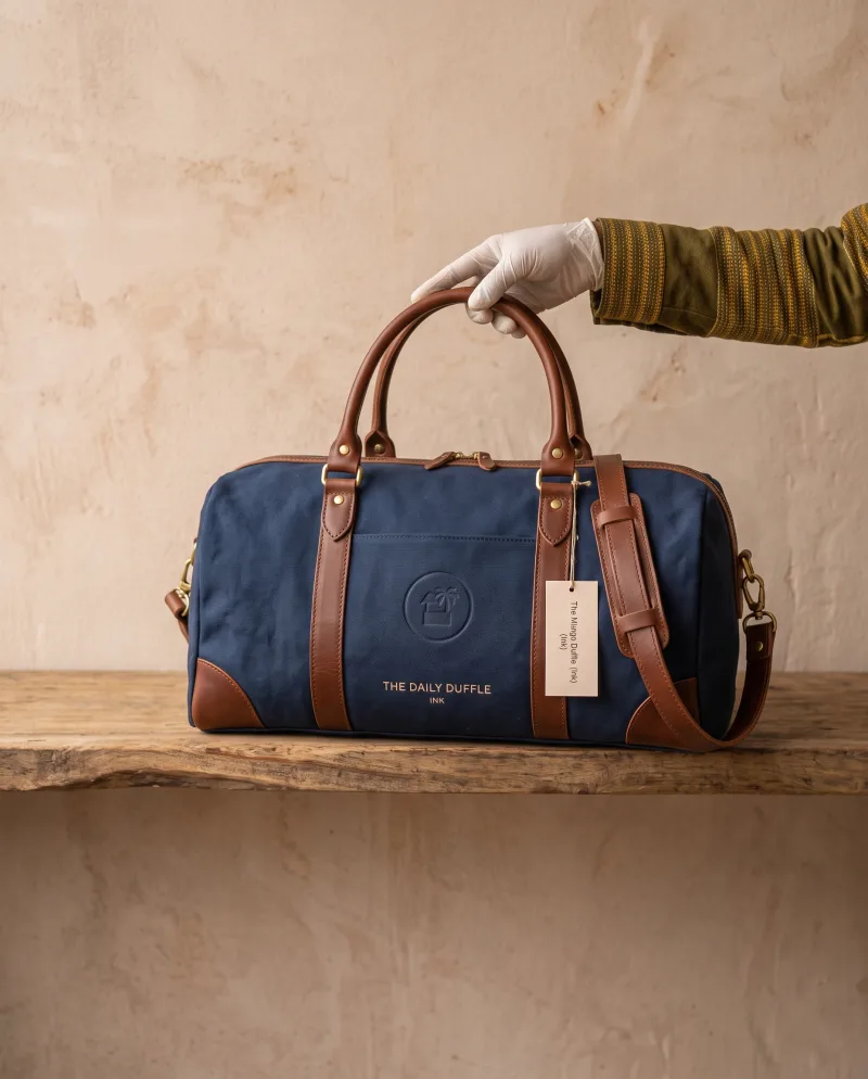 The Mlango Crossbody in warm clay, finished with a sculptural clasp